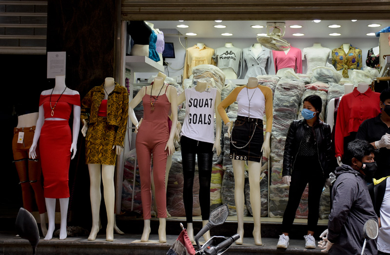 A shopkeeper waits for customers alongside the mannequins amid nationwide lockdown, in New Road, Kathmandu, on Thursday, June 04, 2020. Photo: Naresh Shrestha/THT 