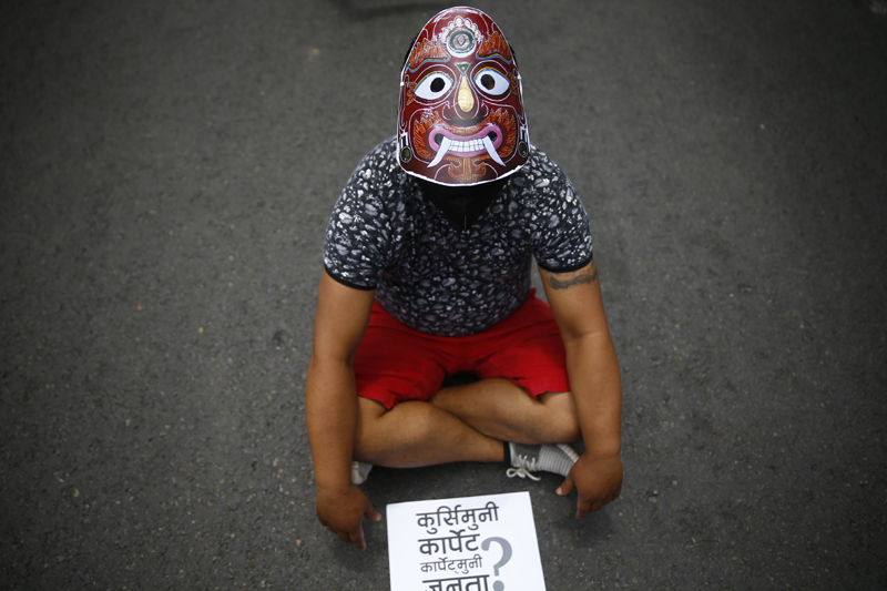 Youths stage a peaceful protest against incompetence of the government in dealing with coronavirus crisis, in Maitighar, Kathmandu, on Saturday, June 13, 2020. Photo: Skanda Gautam/THT