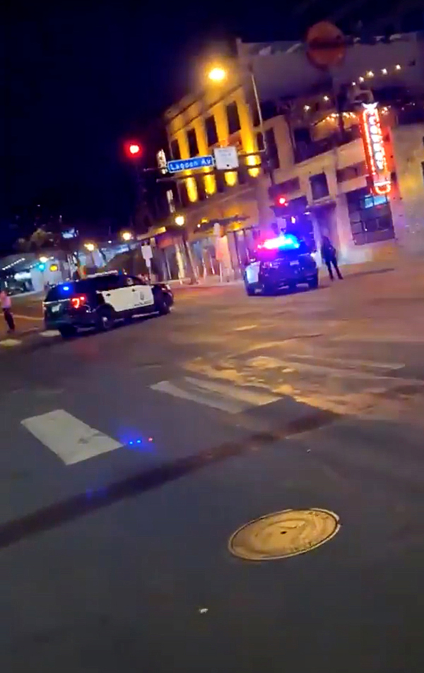 Police vehicles block the road after a shooting in Minneapolis, Minnesota, U.S. June 21, 2020, in this picture obtained from social media video. Photo: TWITTER @MRMINNESOTA24 /via Reuters