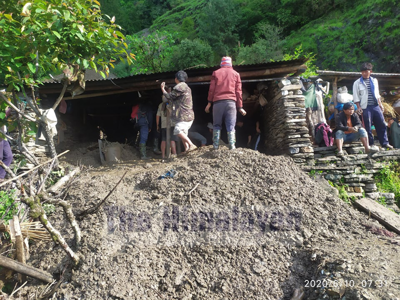 Police and locals gather around the site of landslide, in Myagdi, on Wednesday, June 10, 2020. Photo: Rishi Ram Baral/THT