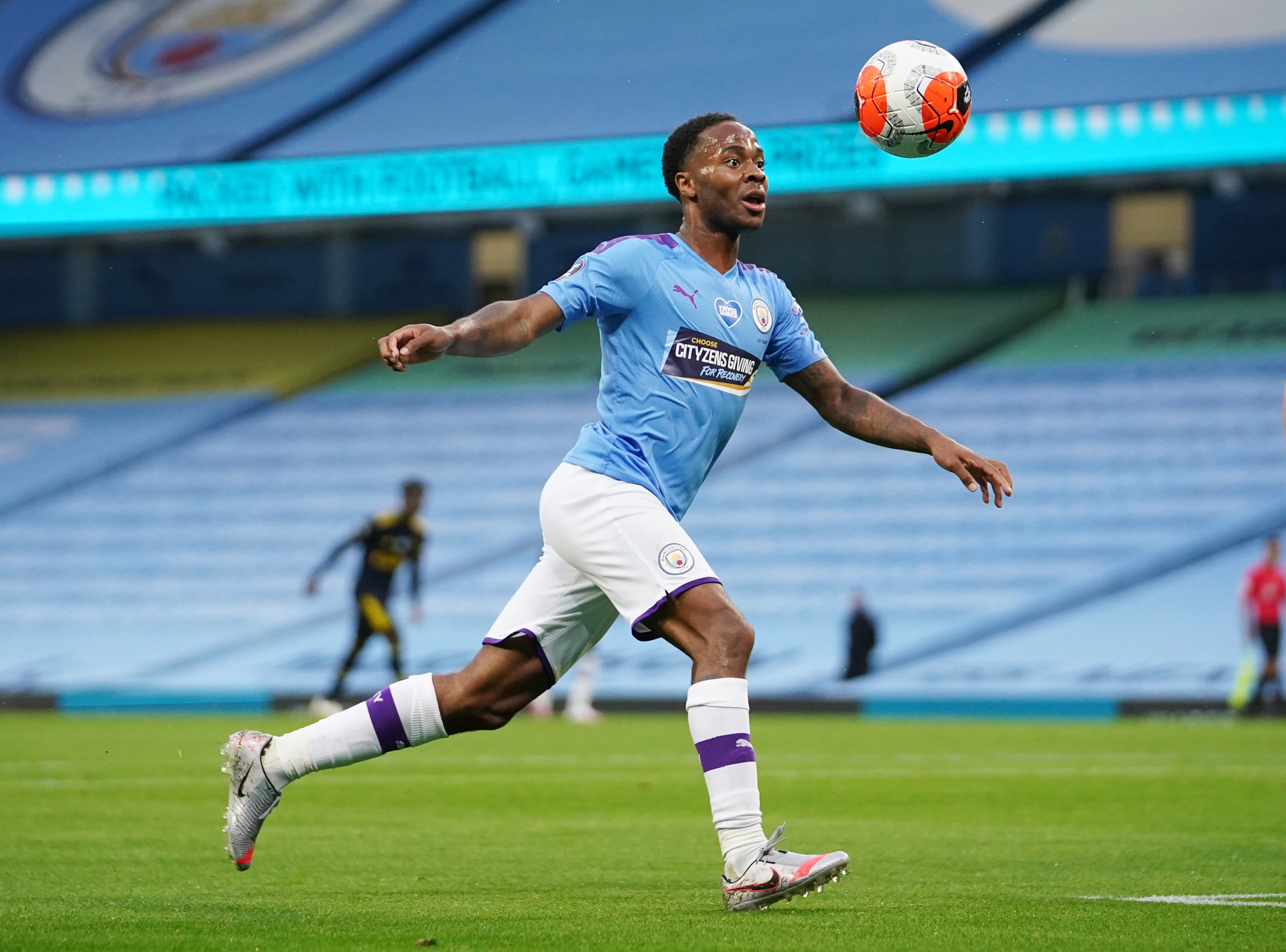 Manchester City's Raheem Sterling scores their first goal as play resumes behind closed doors following the outbreak of the coronavirus disease (COVID-19) during the Premier League match between Manchester City and Arsenal, at Etihad Stadium, in Manchester, Britain, on June 17, 2020. Photo: Dave Thompson/Pool via Reuters