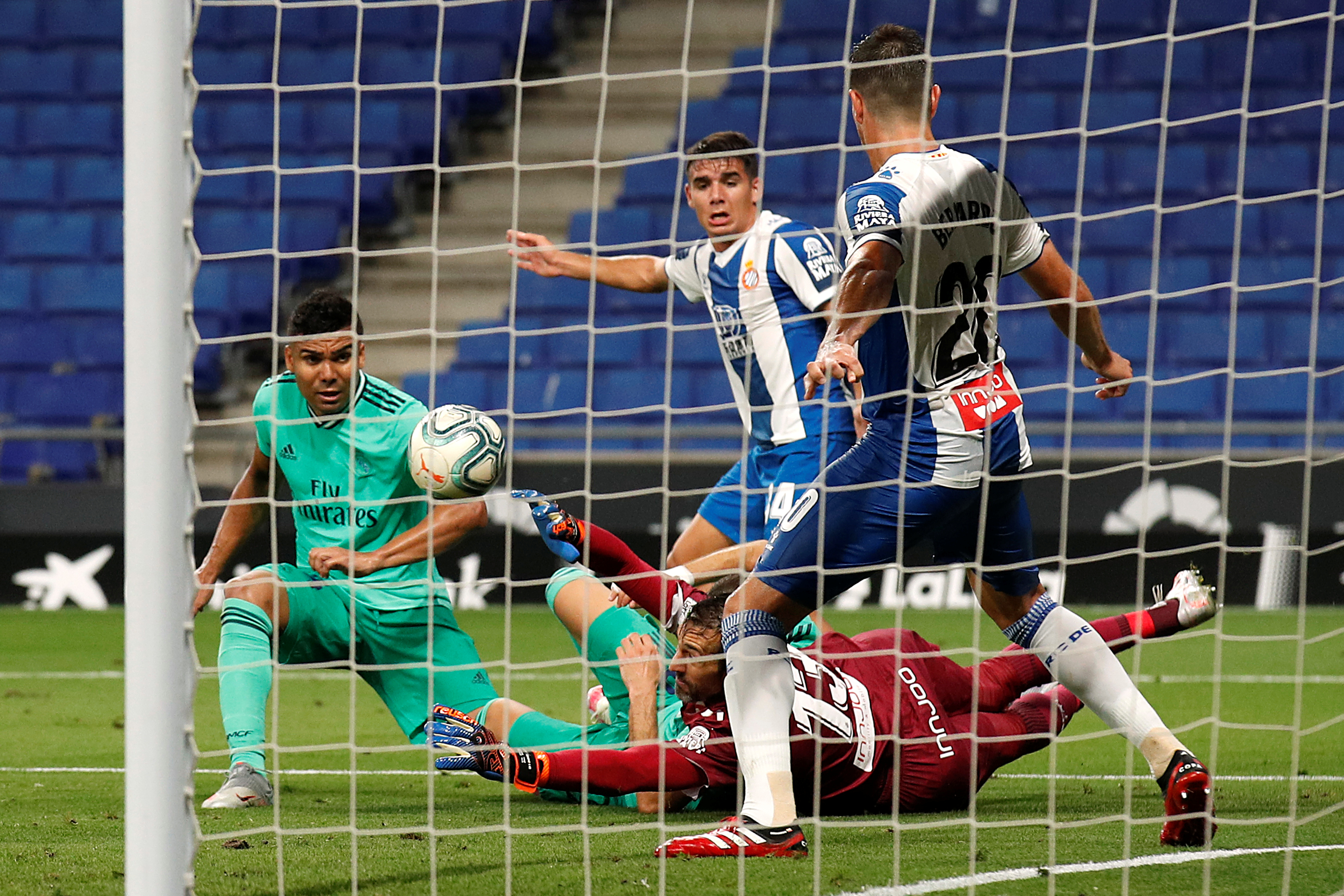 Espanyol's Diego Lopez in action with Real Madrid's Casemiro, as play resumes behind closed doors following the outbreak of the coronavirus disease (COVID-19) during the  La Liga Santander n match between Espanyol and Real Madrid, at RCDE Stadium, in Barcelona, Spain, on June 28, 2020. Photo: Reuters