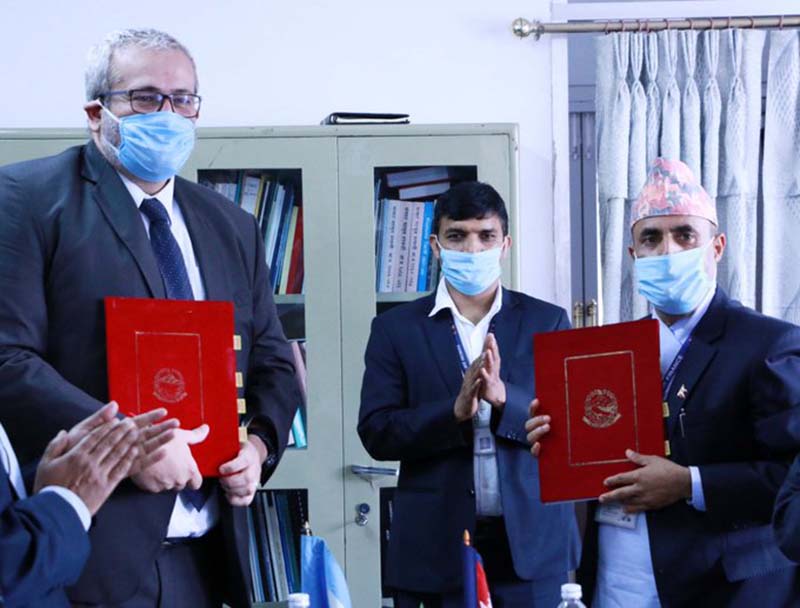 Finance Secretary Sishir Kumar Dhungana (right) and World Bank Country Manager for Nepal Faris Hadad-Zervos (left) after signing the agreement of 100 million US dollars Development Policy Credit  for Nepal's energy sector to improve the financial viability and during the COVID19 crisis and for post-crisis recovery, in Kathmandu, on Wednesday, June 24, 2020. Photo: WorldBankNepal/ Twitter