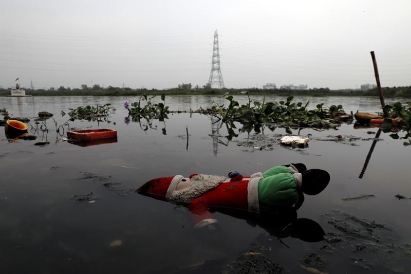 A stuffed toy is seen lying in the waters of the Yamuna river ahead of World Environment Day, in the old quarters of Delhi, India, June 4, 2020. Photo: Reuters