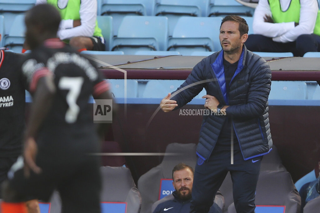 Chelsea's head coach Frank Lampard gestures during the English Premier League soccer match between Aston Villa and Chelsea at the Villa Park stadium in Birmingham, England, Sunday, June 21, 2020. (Molly Darlington/Pool via AP)