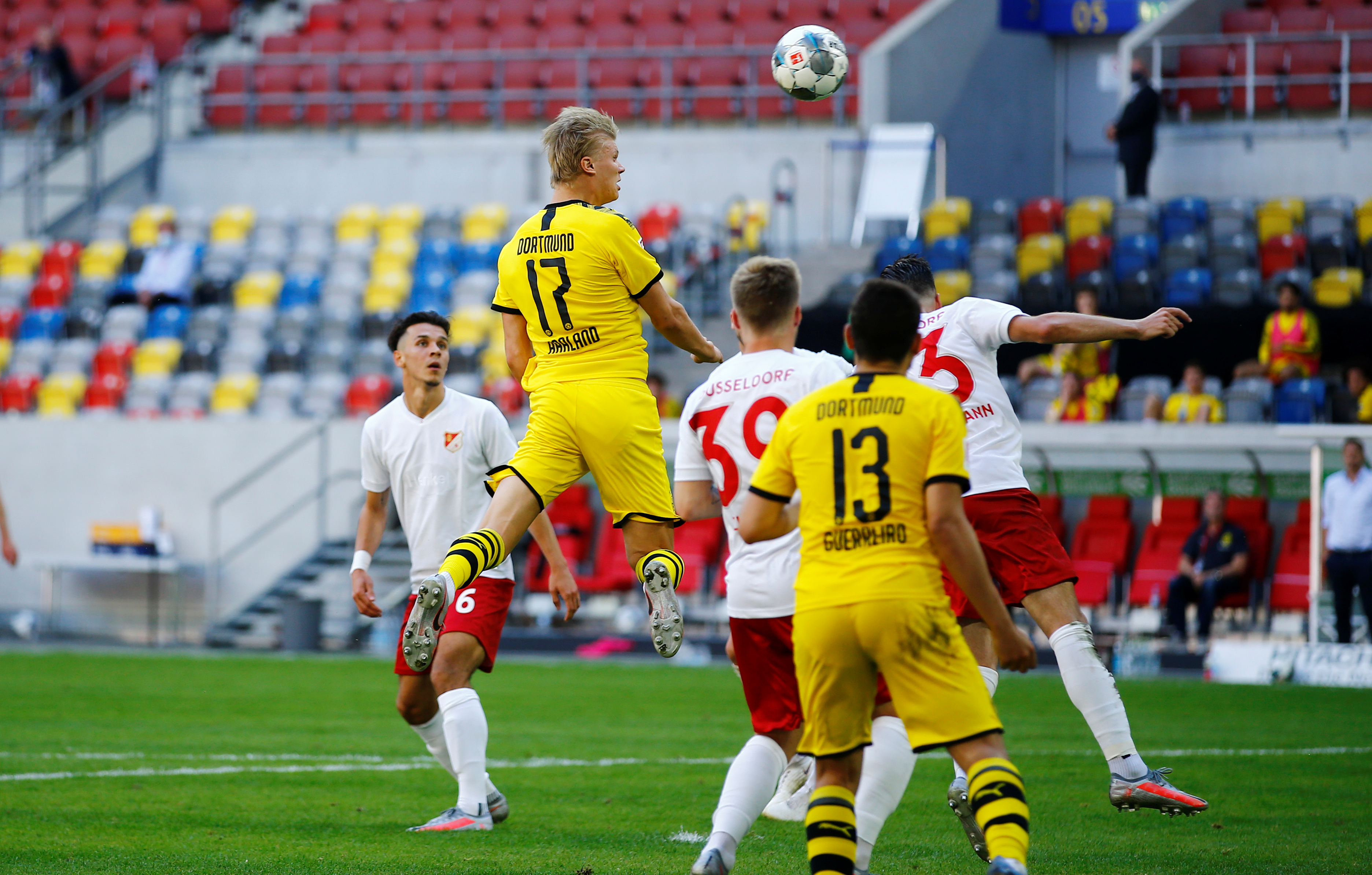Borussia Dortmund's Erling Braut Haaland scores their first goal, as play resumes behind closed doors following the outbreak of the coronavirus disease (COVID-19) during the Bundesliga match between Fortuna Dusseldorf and Borussia Dortmund, at Merkur Spiel-Arena, in Dusseldorf, Germany, on June 13, 2020. Photo: Reuters