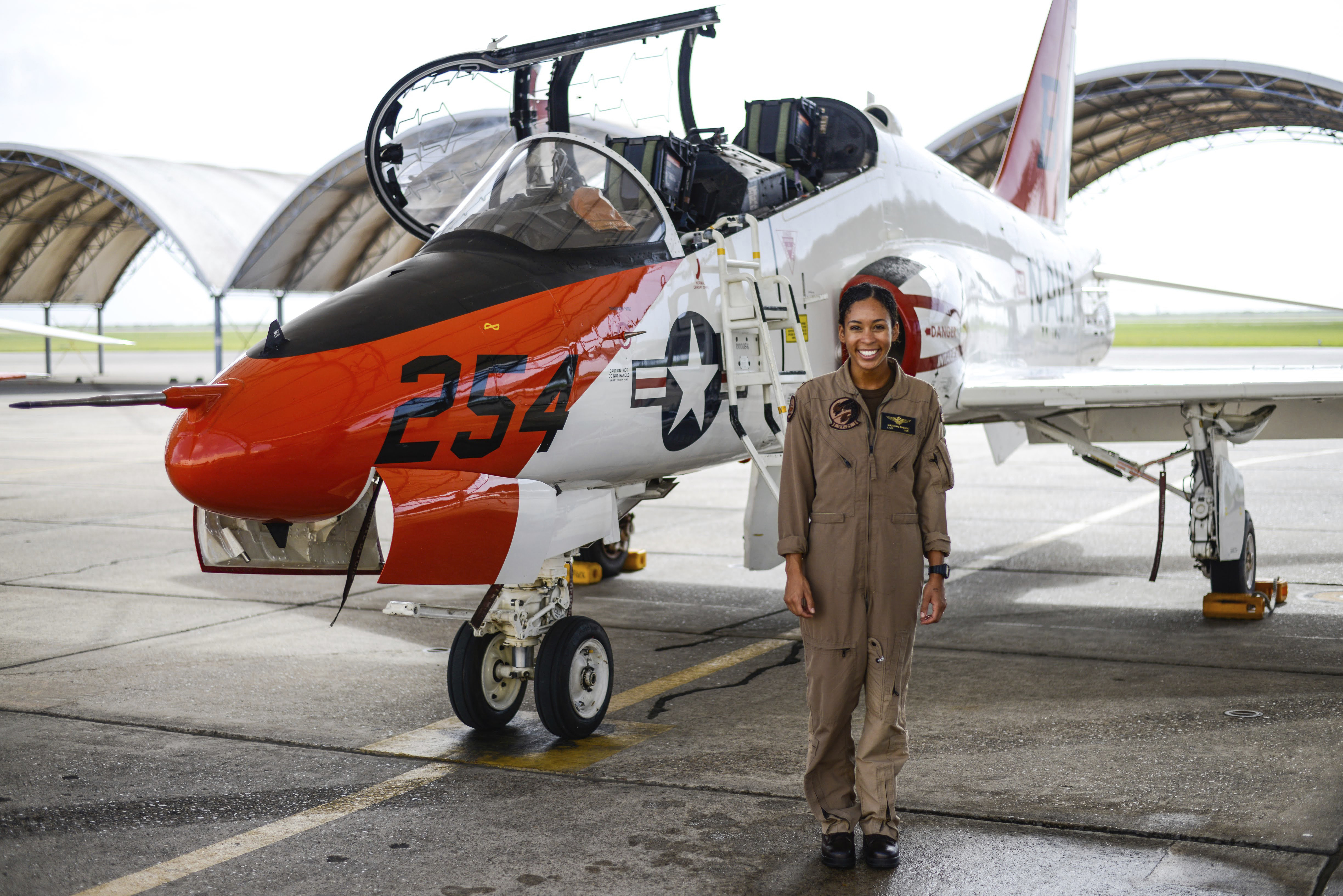 In this photo provided by the U.S. Navy, student Naval aviator Lt. j.g. Madeline Swegle, assigned to the Redhawks of Training Squadron (VT) 21 at Naval Air Station Kingsville, Texas, stands by a T-45C Goshawk training aircraft following her final flight to complete the undergraduate Tactical Air (Strike) pilot training syllabus, July 7, 2020, in Kingsville, Texas. Swegle is the Navy's first known Black female strike aviator and will receive her Wings of Gold during a ceremony on July 31. Photo: AP