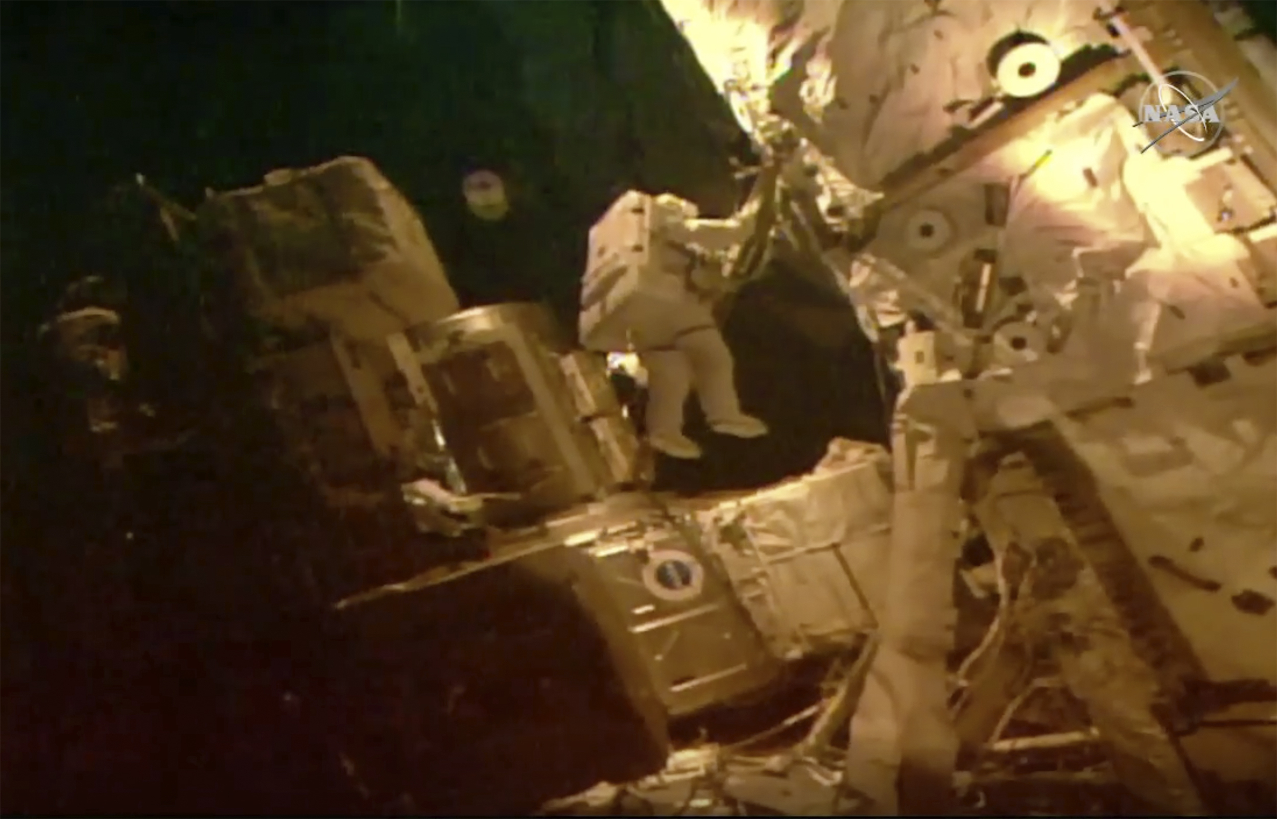 This photo provided by NASA shows astronauts Bob Behnken and Chris Cassidy on a spacewalk outside of the International Space Station on Tuesday, July 21, 2020. The astronauts are on their fourth and final spacewalk in under a month and instead of swapping batteries, they'll be routing cables and hooking up a tool storage chest.  Photo: AP