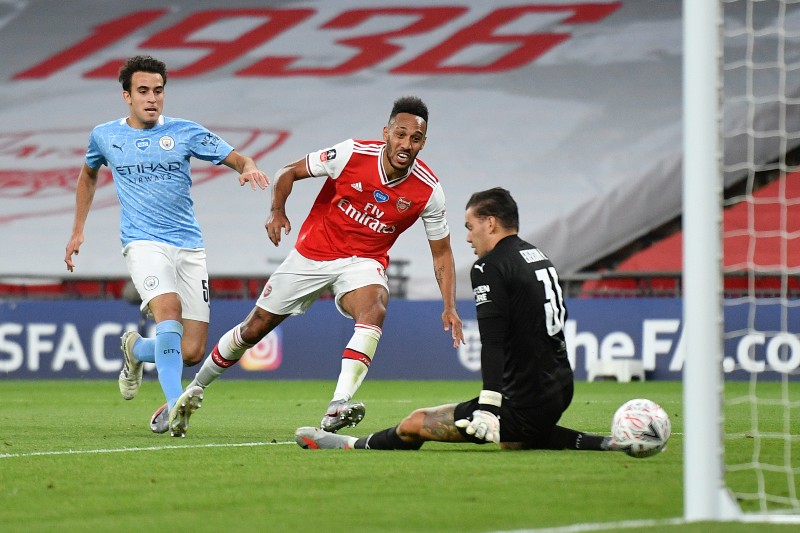 Arsenal's Pierre-Emerick Aubameyang scores their second goal, as play resumes behind closed doors following the outbreak of the coronavirus disease (COVID-19) during the  FA Cup Semi Final match between Arsenal and Manchester City , at Wembley Stadium, in London, Britain, on July 18, 2020. Photo: Justin Tallis/Pool via Reuters