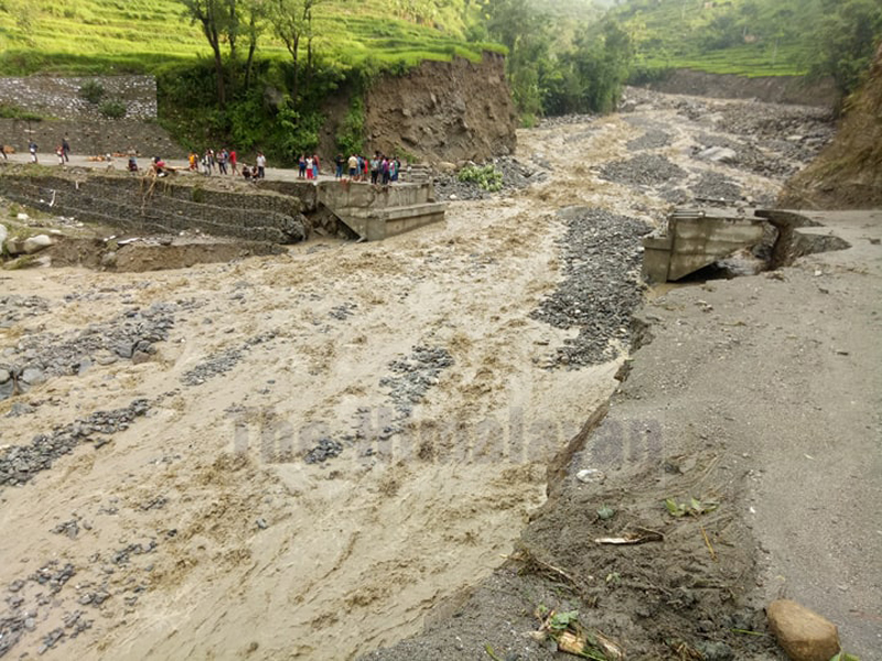 Flood in Ghatte Khola swept away bridge in Tapresera, Budhiganga Municipality, Bajura, on Sunday night, as seen on Monday, July 20, 2020. Photo: Prakash Singh/THT