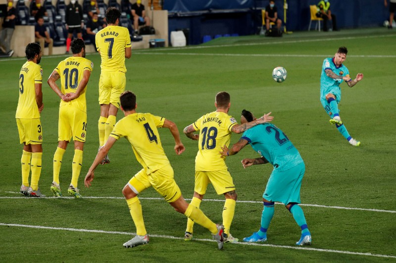 Barcelona's Lionel Messi shoots at goal, as play resumes behind closed doors following the outbreak of the coronavirus disease (COVID-19) during the La Liga match between Villarreal and FC Barcelona, at  Estadio de la Ceramica, in Villarreal, Spain, on July 5, 2020. Photo: Reuters