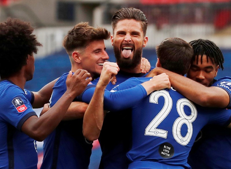 Chelsea's Olivier Giroud celebrates scoring their first goal with teammates, as play resumes behind closed doors following the outbreak of the coronavirus disease (COVID-19) during the FA Cup Semi Final match between Manchester United amd Chelsea, at Wembley Stadium, in London, Britain, on  July 19, 2020. Photo: Pool via Reuters
