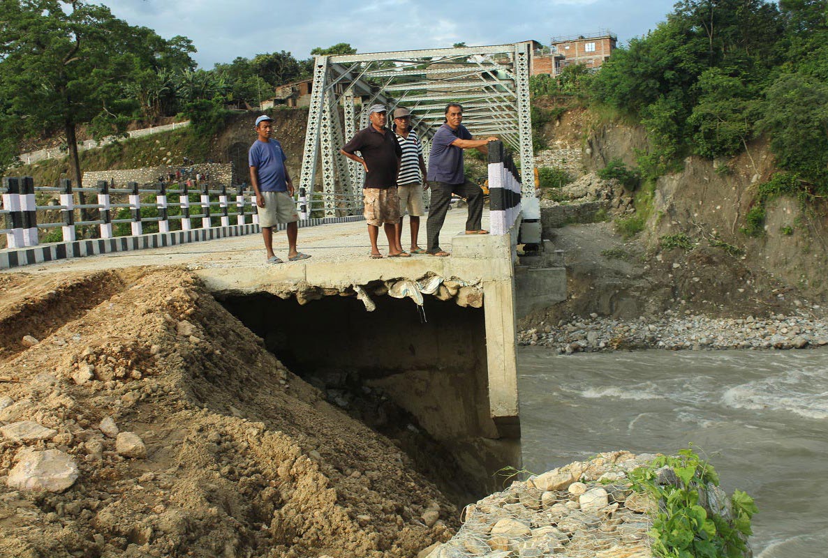 A view of a damaged part of a bridge over the Marsyangdi River in Tanahun, on Sunday. Photo: THT