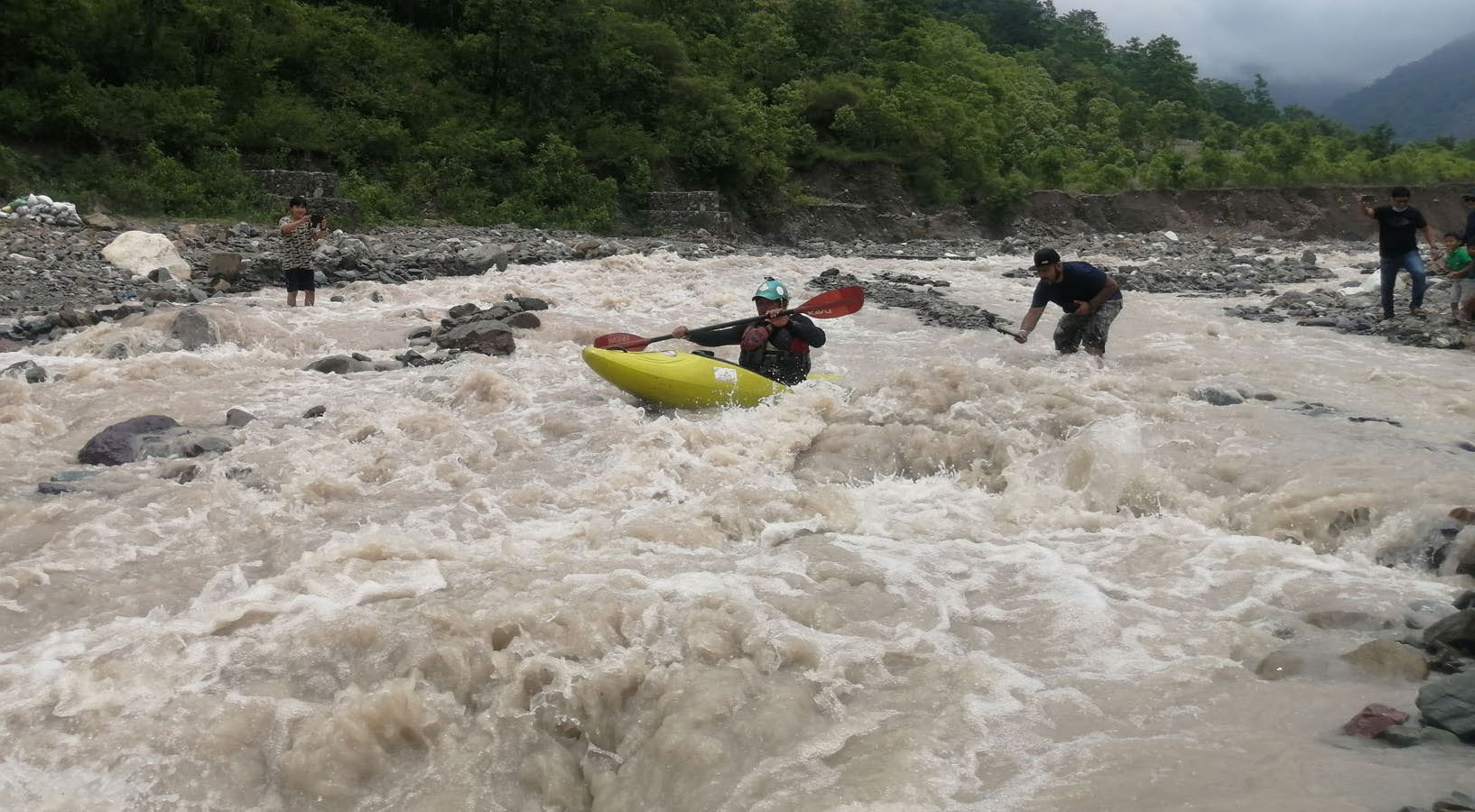 A sports enthusiast kayaking in a local rivulet, in Dharan, on Saturday. Photo: RSS
