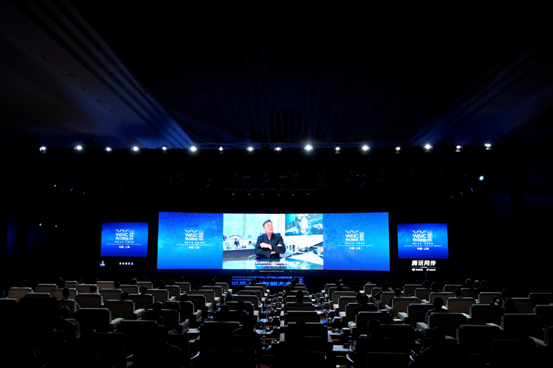 Tesla Inc Chief Executive Officer Elon Musk is seen on a screen during a video message at the opening ceremony of the World Artificial Intelligence Conference (WAIC) in Shanghai, China July 9, 2020. Photo: Reuters