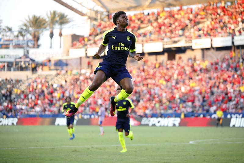 FILE - Arsenal's Chuba Akpom leaps after scoring aginst Chivas Guadalajara during a friendly soccer match in Carson, California, USA, on Sunday, July 31, 2016. Photo: AP