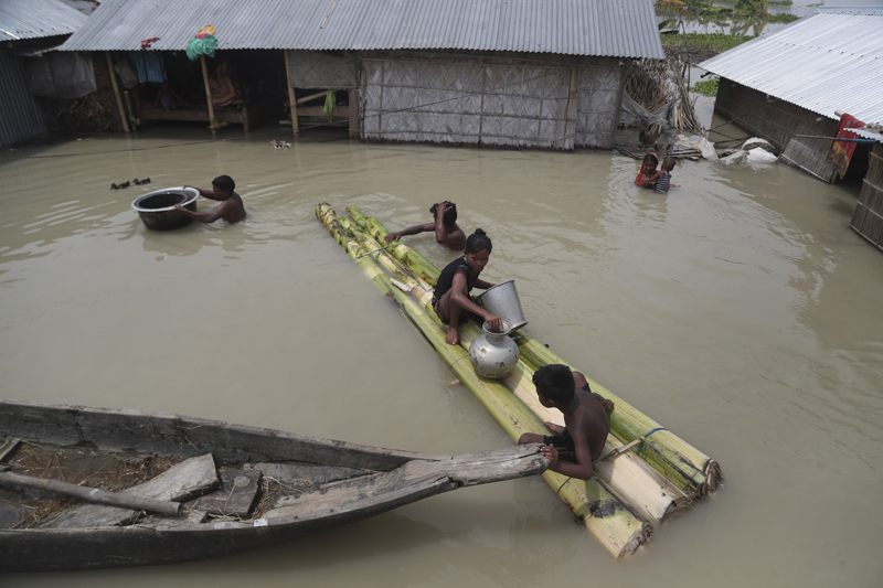 Flood affected villagers are seen near their partially submerged houses in Gagolmari village, Morigaon district, Assam, India, Tuesday, July 14, 2020. Photo: AP
