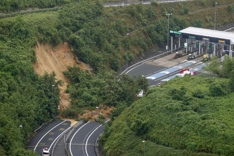 A landslide is seen near an exit of a highway in Kyoto, western Japan Thursday, July 9, 2020. Pounding rain spread to central Japan and triggered mudslides. Photo: Kyodo News via AP