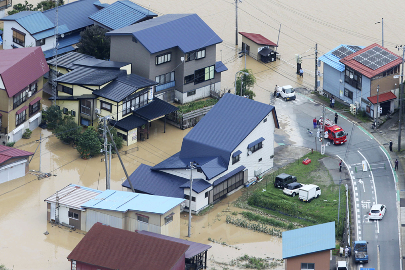 A residential area is flooded following a heavy rain in Okura village, Yamagata prefecture, northern Japan Wednesday, July 29, 2020. Photo: Kyodo News via AP