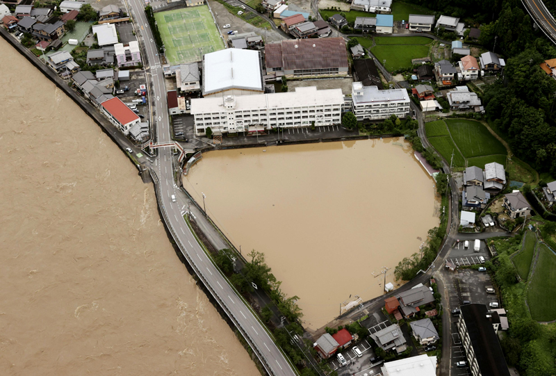 A schoolyard of a junior high school is seen flooded following heavy rains in Gero, Gifu prefecture, southern Japan Wednesday, July 8, 2020. Photo: Kyodo News via AP