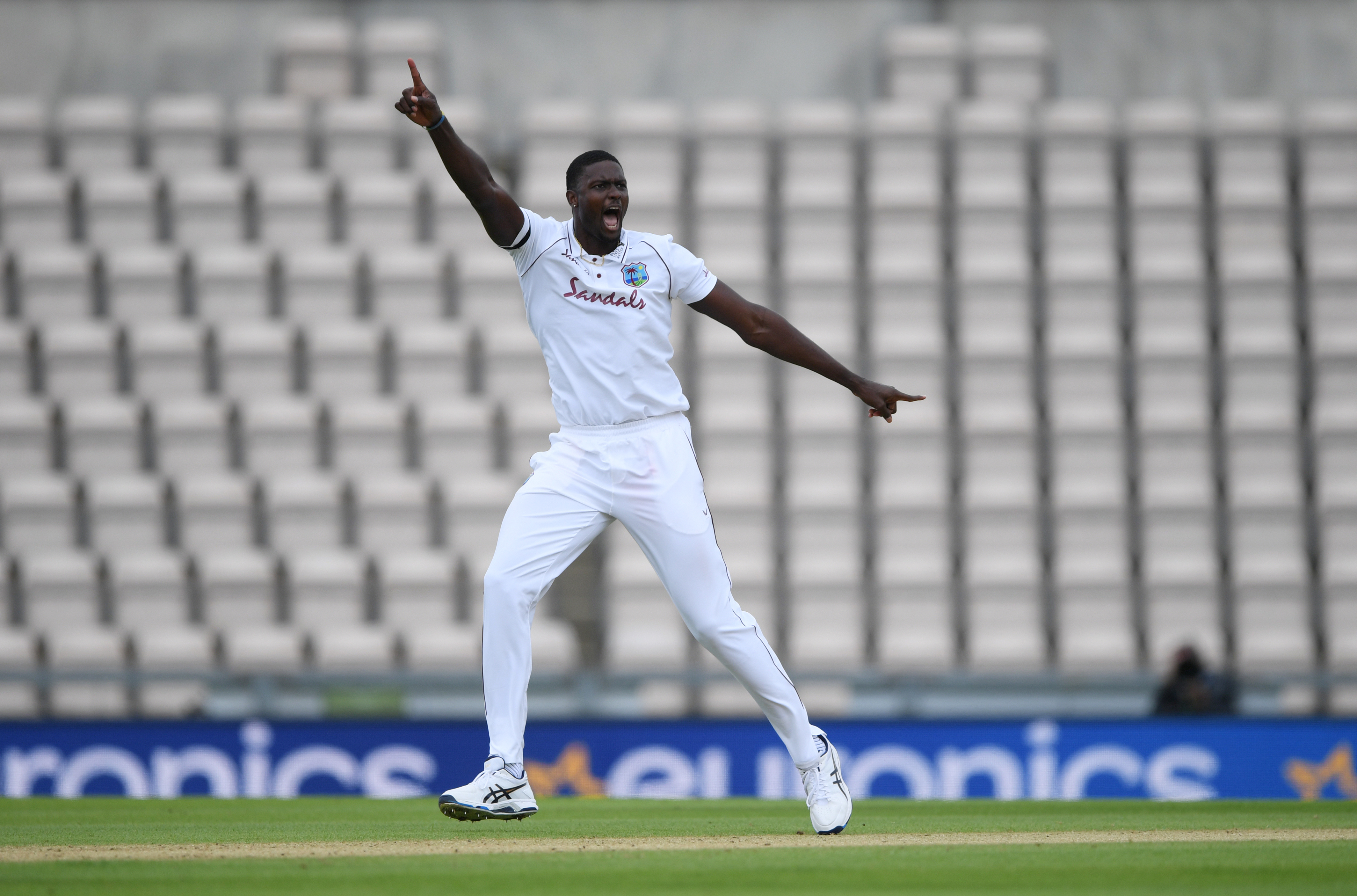 West Indies' Jason Holder celebrates taking the wicket of England's Ben Stokes, as play resumes behind closed doors following the outbreak of the coronavirus disease (COVID-19). Photo: Reuters   