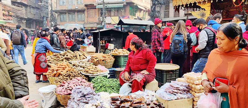 This undated image shows vendors selling vegetables, and customers in a market, in Kathmandu. Photo: THT
