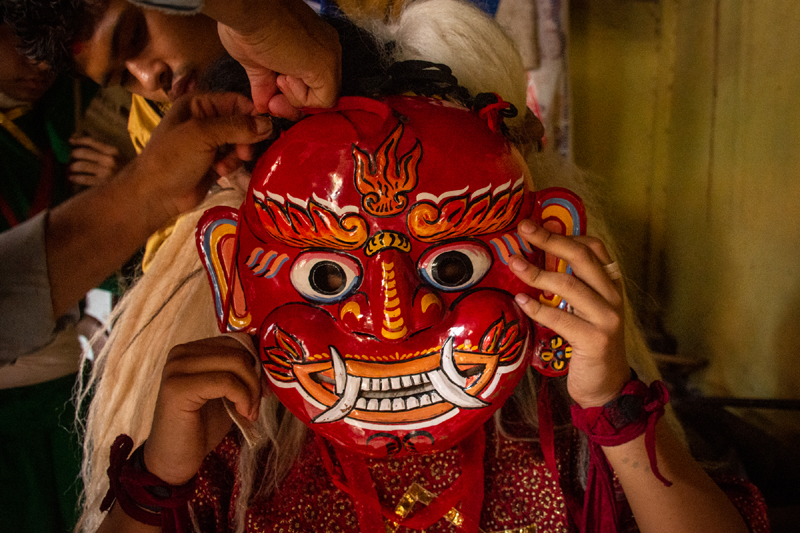 A person dressed as a “Mi pwa Lakhey” clicked before traditional Lakhey dance performance, with fire during Gathan Mugah (Ghanta Karna) festival in Lalitpur on Sunday, July 19, 2020. Photo: Naresh Shrestha/THT