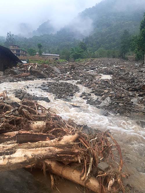 A pile of driftwood carried by rain-triggered flood in Madhya Nepal Municipality, Lamung district, in July 2020. Photo: Ramji Rana/THT