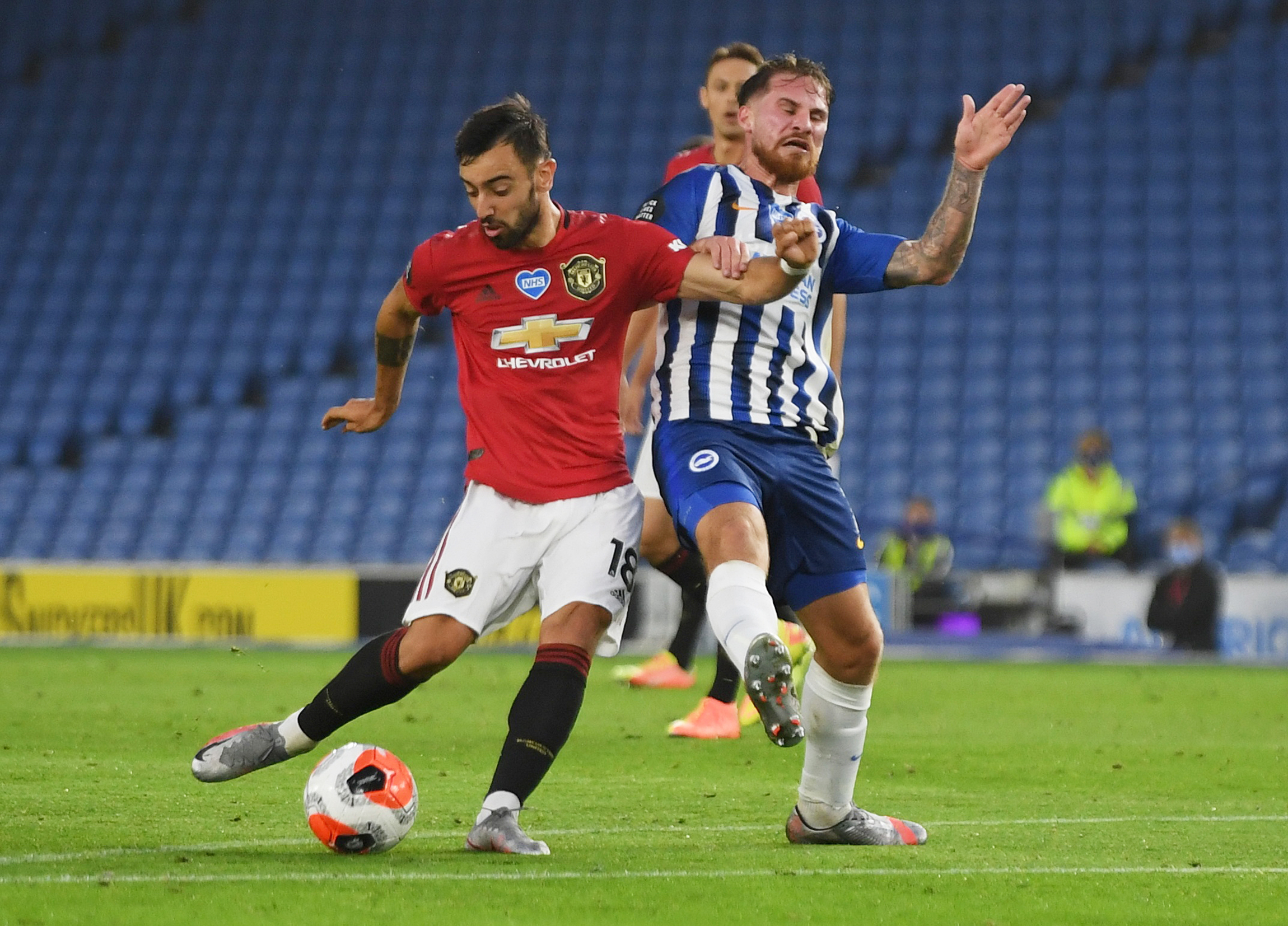 Manchester United's Bruno Fernandes scores their second goal, as play resumes behind closed doors following the outbreak of the coronavirus disease (COVID-19) during the Premier League -match between Brighton & Hove Albion and Manchester United, at The American Express Community Stadium, in Brighton, Britain, on June 30, 2020. Photo: Mike Hewitt/Pool via Reuters