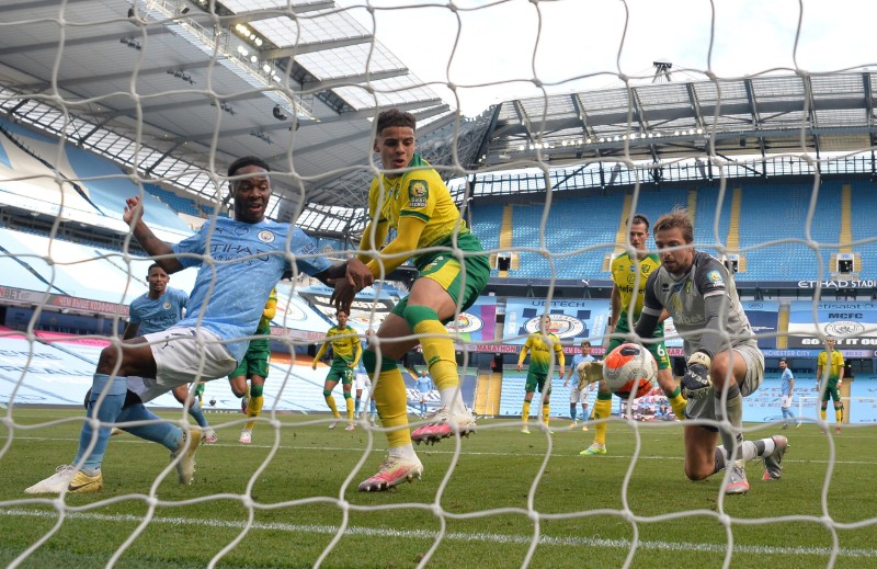 Manchester City's Raheem Sterling in action with Norwich City's Tim Krul during their Premier League match at Etihad Stadium in Manchester City, on July 26, 2020, as play resumes behind closed doors following the outbreak of the coronavirus disease (COVID-19). Photo: Pool via Reuters.