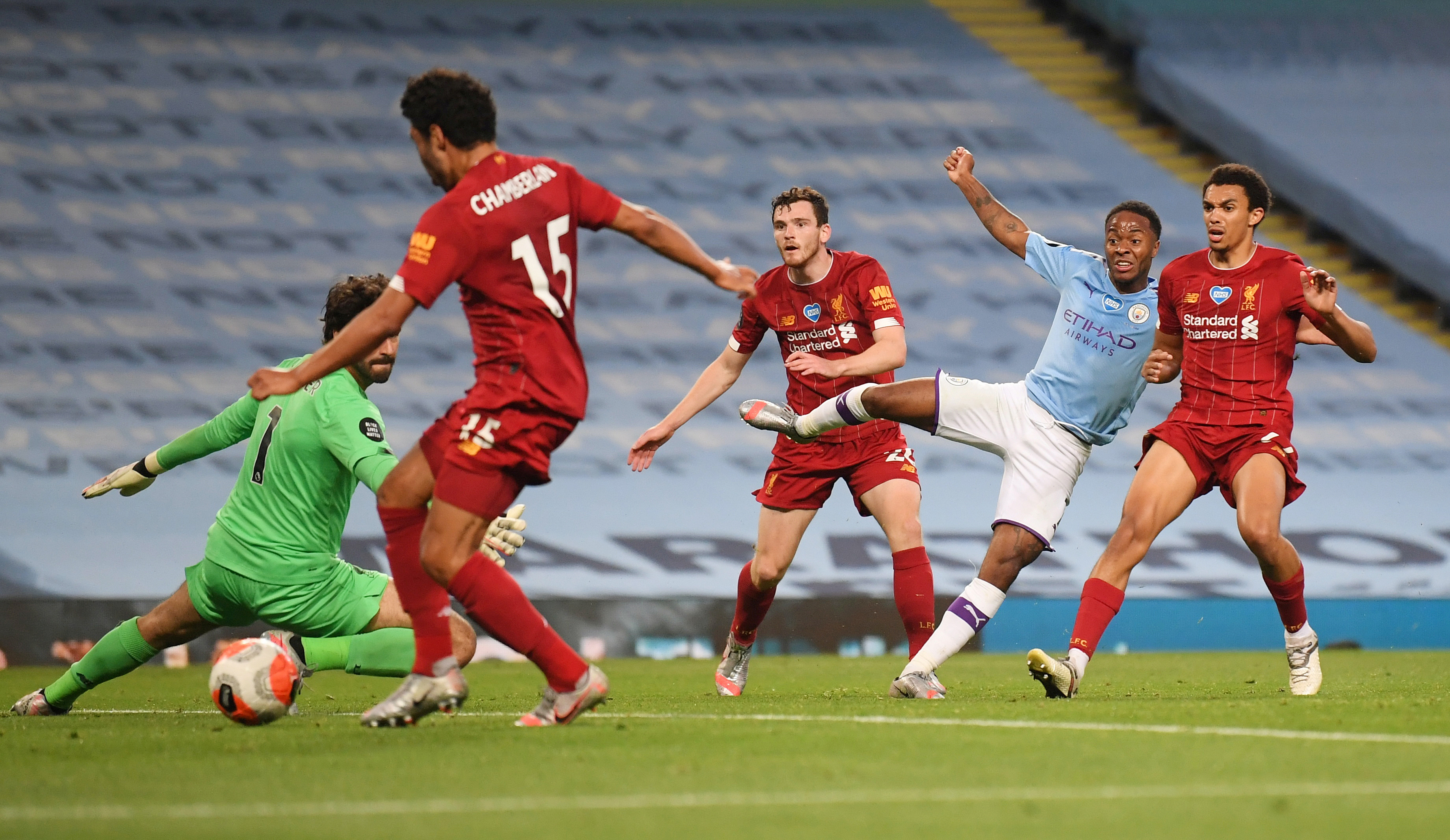 Manchester City's Raheem Sterling scores their fourth goal, as play resumes behind closed doors following the outbreak of the coronavirus disease (COVID-19) during the Premier League match between Manchester City and Liverpool, at Etihad Stadium, in Manchester, Britain, on July 2, 2020. Photo: Laurence Griffiths/Pool via Reuters