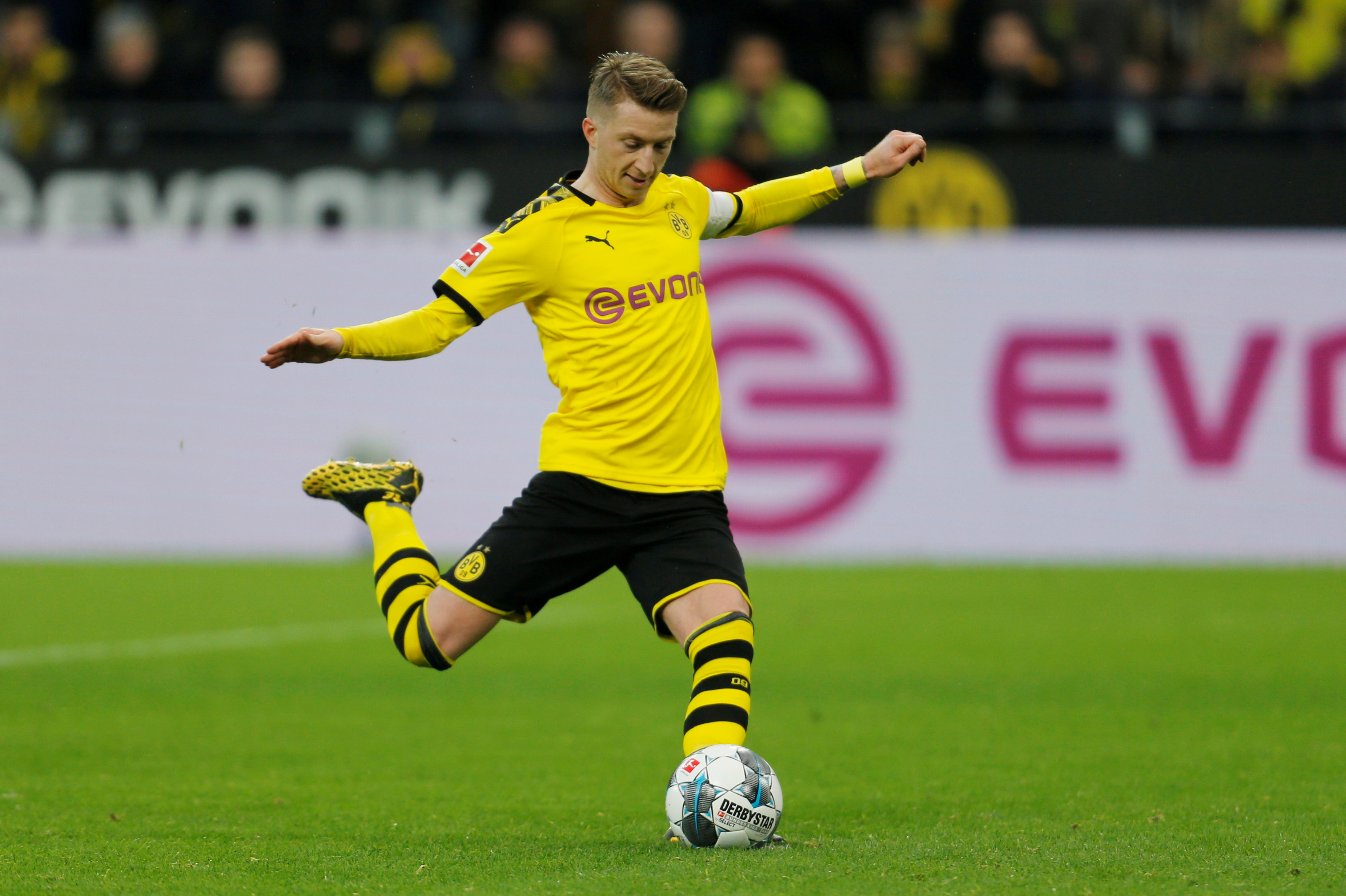 Borussia Dortmund's Marco Reus scores their third goal from the penalty spot. Photo: Reuters   