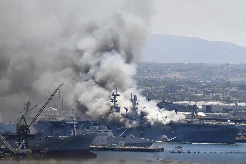 Smoke rises from the USS Bonhomme Richard at Naval Base San Diego, in San Diego, Sunday, July 12, 2020. Explosion and fire aboard the ship was reported on Sunday. Photo: AP