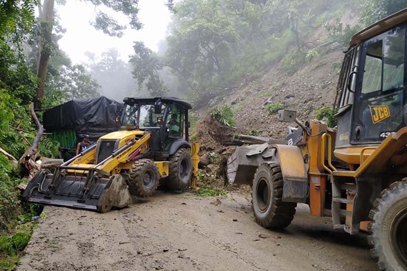 This image shows two bulldozers removing landslide debris from road in Daunne, Binayi Triveni Rural Municipality-2 of Nawalpur district, on Tuesday, July 14, 2020. Photo: Shreeram Sigdel