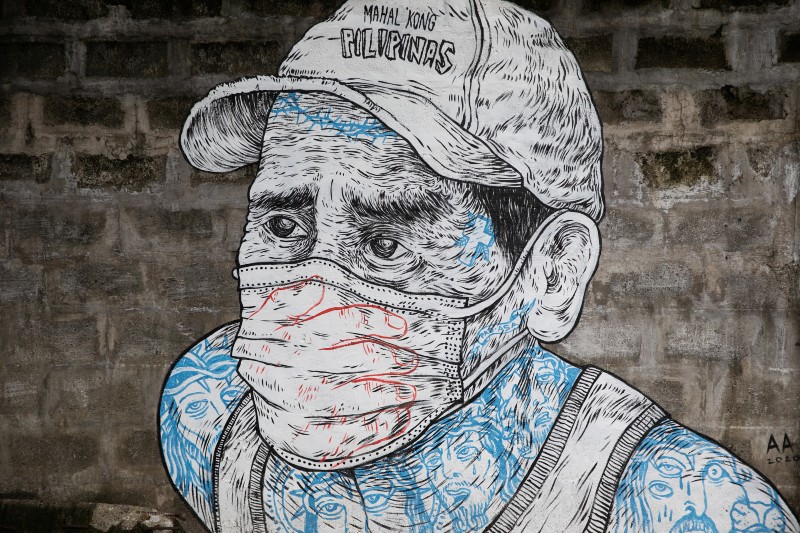 A mural of a man wearing a mask is pictured on a sidewalk amid the coronavirus disease (COVID-19) outbreak in Quezon City, Metro Manila, Philippines, July 30, 2020. Photo: Reuters
