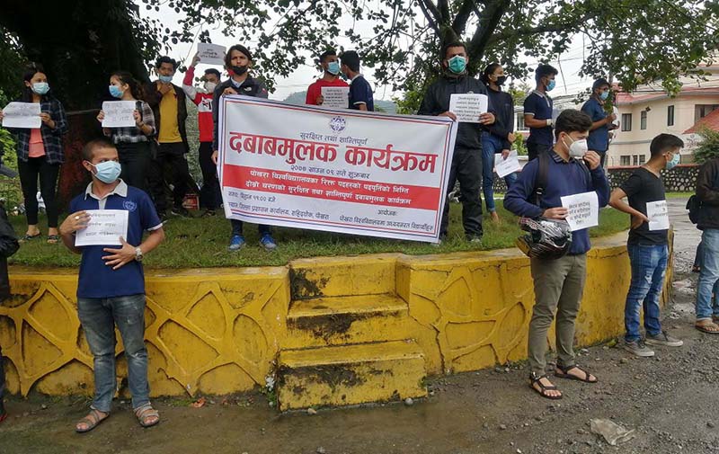 Students of Pokhara University staging a sit-in, in front of the Kaski District Administration Office, in Pokhara, on Friday, July 24, 2020. Photo: THT
