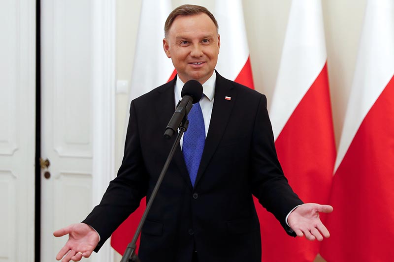 Polish President and presidential candidate of the Law and Justice (PiS) party Andrzej Duda talks to the media after the announcement of the first exit poll results on the second round of the presidential election, at the Presidential Palace in Warsaw, Poland, July 12, 2020. Photo: Reuters
