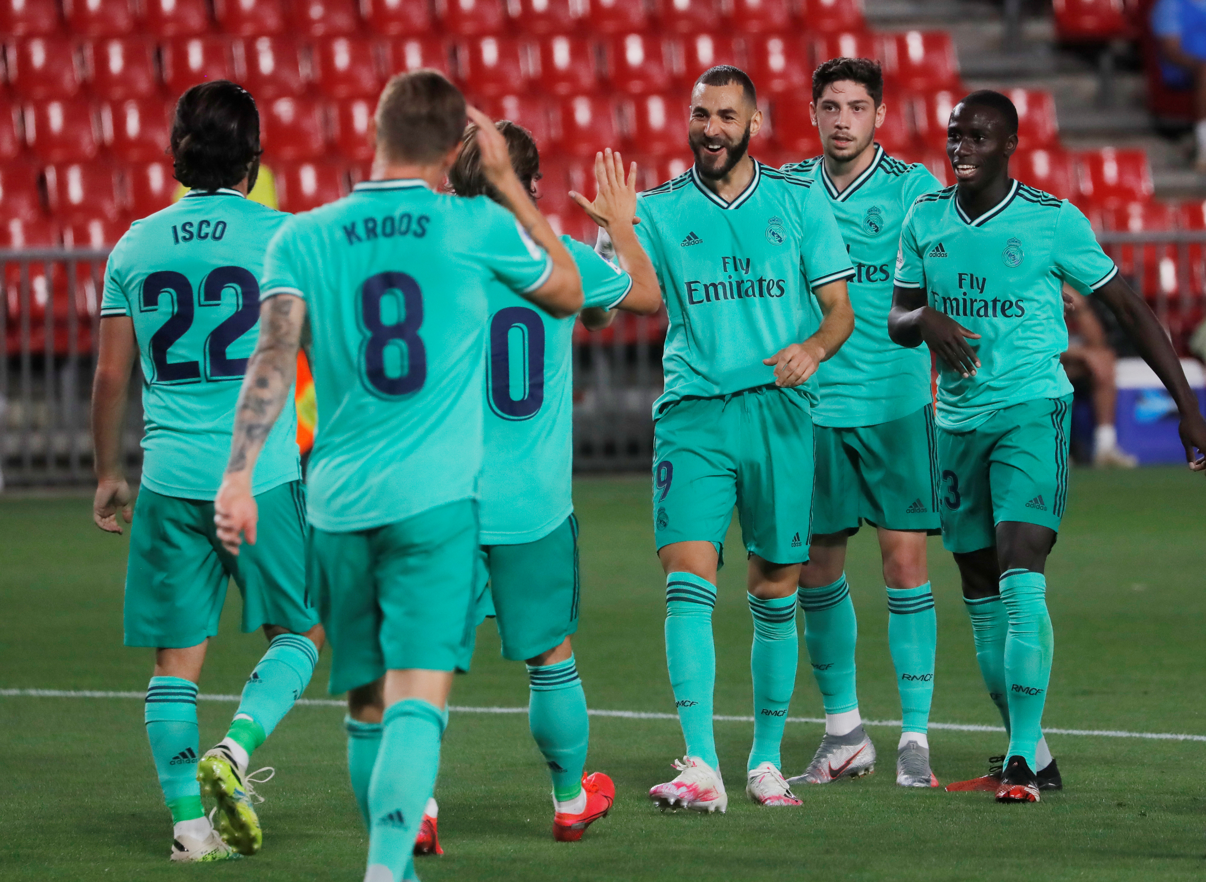 Real Madrid's Karim Benzema celebrates scoring their second goal with teammates, as play resumes behind closed doors following the outbreak of the coronavirus disease (COVID-19). Photo: Reuters  