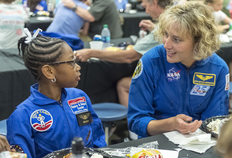 NASA astronaut Dottie Metcalf-Lindenburger talks with Space Camp camper Bria Jackson, of Atlanta, before giving a speech at the U.S. Space &amp; Rocket Center in Huntsville, Ala. in this July 13, 2018 file photo. Photo: AP/File