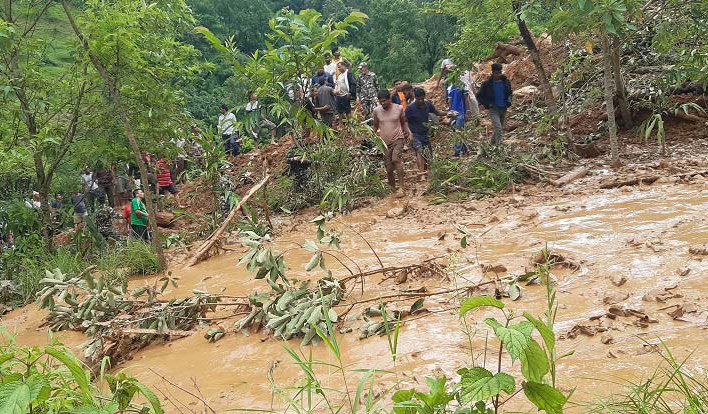 Locals along with security personnel taking stock of the landslide site in Kaligandaki Rural Municipality, Syangja, on Tuesday. Photo: THT