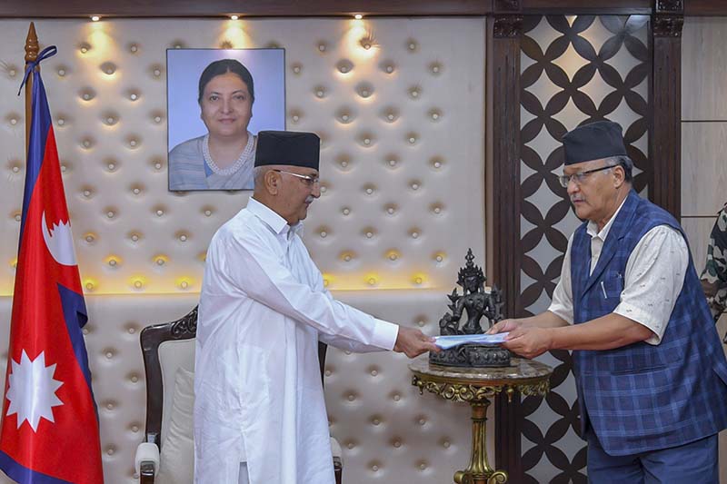President of the Federation of Nepalese National Transport Entrepreneurs (FNNTE) Yogendra Nath Karmacharya (right) hands over the memo to Prime Minister KP Sharma Oli, at this official residence in Baluwatar, Kathmandu, on Thursday, July 16, 2020. Photo: Rajan Kafle/PM's secretariat