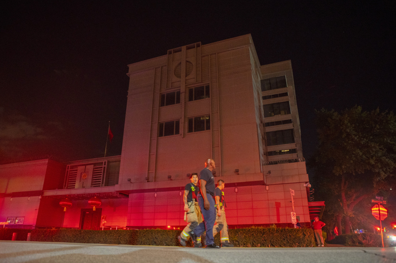 In this July 21, 2020, file photo the Houston Fire Department responds to reports of a fire inside the Chinese Consulate in Houston. In shutting each otheru0092s consulates, the United States and China have done more than strike symbolic blows in their escalating feud. For China, the loss of its mission in Houston dims its view of Americau0092s South and, according to U.S. officials, removes the nerve center of a Chinese spying network that spanned more than two dozen cities, collecting intelligence, trying to steal trade secrets and proprietary technology and research. Photo: Mark Mulligan/Houston Chronicle via AP/File
