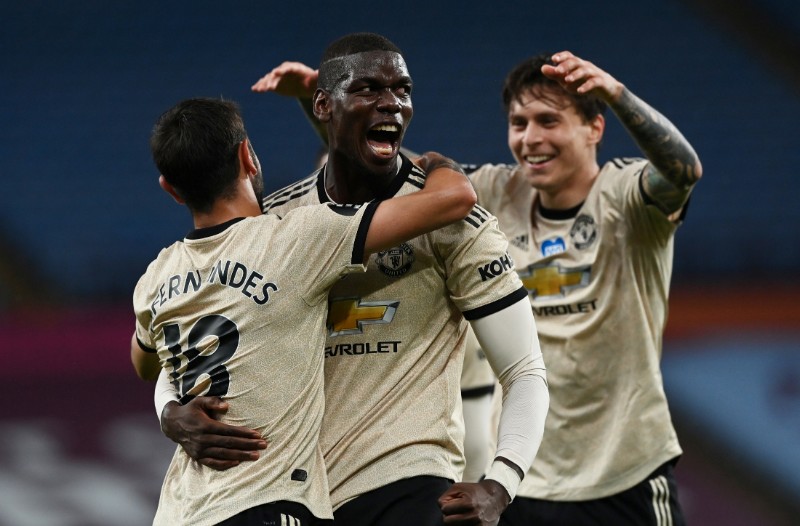 Manchester United's Paul Pogba celebrates scoring their third goal with teammates, as play resumes behind closed doors following the outbreak of the coronavirus disease (COVID-19) during the Premier League match between Aston Villa and Manchester United, at Villa Park, Birmingham, in Britain, on  July 9, 2020. Photo: Reuters