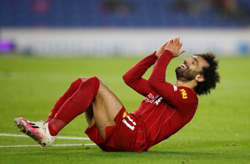 Liverpool's Mohamed Salah reacts, as play resumes behind closed doors following the outbreak of the coronavirus disease (COVID-19) during the Premier League match between Brighton & Hove Albion and Liverpool, at The American Express Community Stadium, in Brighton, Britain, on July 8, 2020. Photo: Reuters