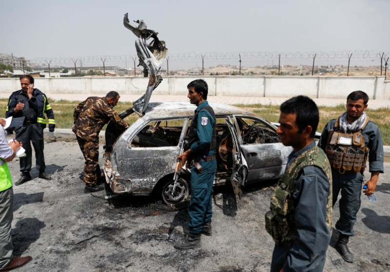 Afghan police officers inspect a vehicle from which insurgents fired rockets, in Kabul, Afghanistan August 18, 2020. Photo: Reuters