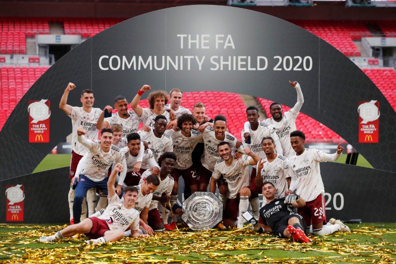 Arsenal players celebrate with the trophy after winning the FA Community Shield, at Wembley Stadium, in London, Britain, on August 29, 2020, as play resumes behind closed doors following the outbreak of the coronavirus disease (COVID-19). Photo: Pool via Reuters