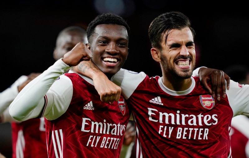 Arsenal's Eddie Nketiah celebrates scoring their second goal with Dani Ceballos during the Premier League match between Arsenal and West Ham United, at Emirates Stadium, in London, Britain, on September 19, 2020. Photo: Pool via Reuters