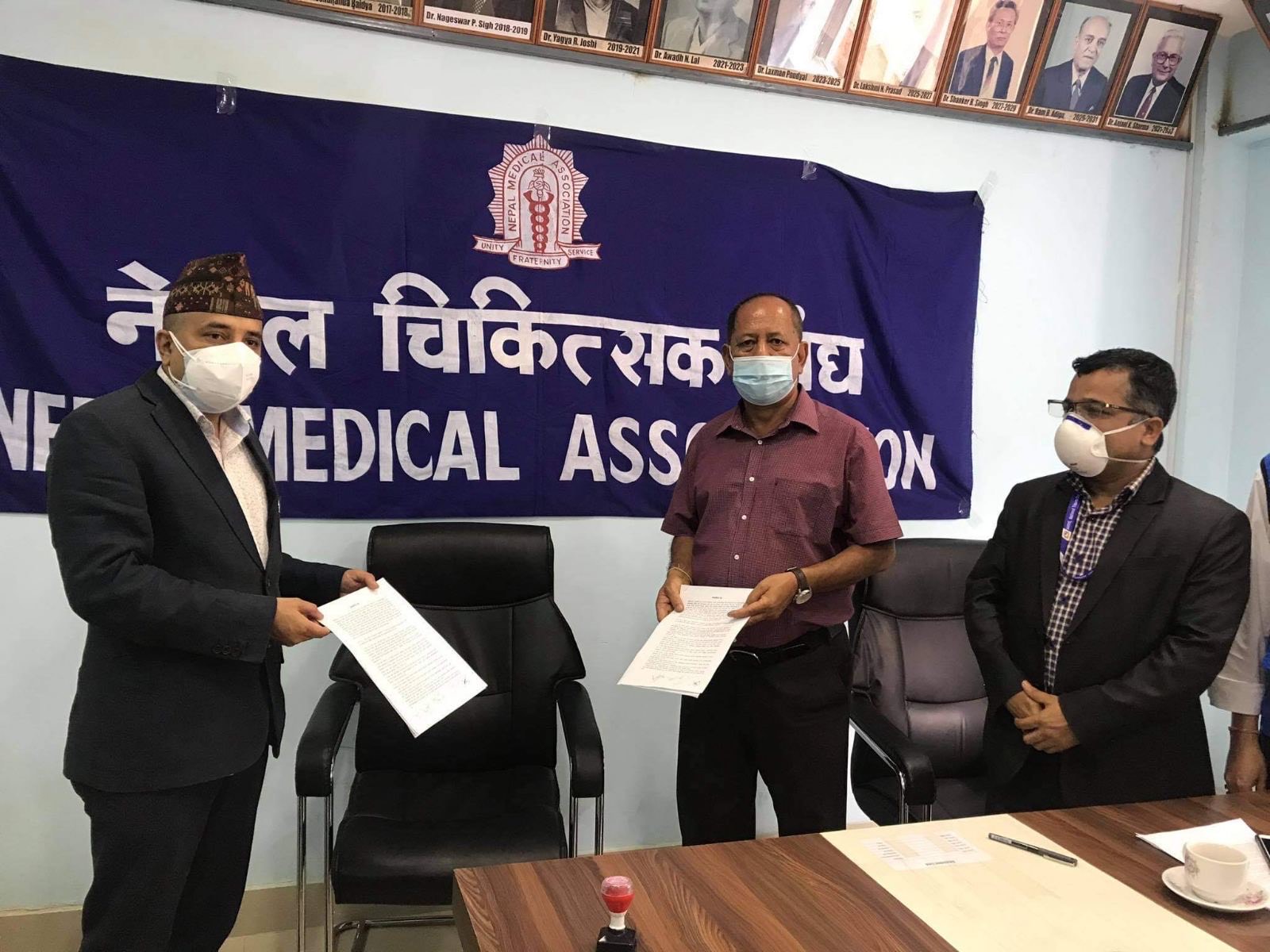 NMA Chairman Dr Lochan Karki (left) and HPFN Chairman Hira Dhoj Shah pose for portrait after signing a MoU in Kathmandu, on Thursday, September 03, 2020. Courtesy: HPFN