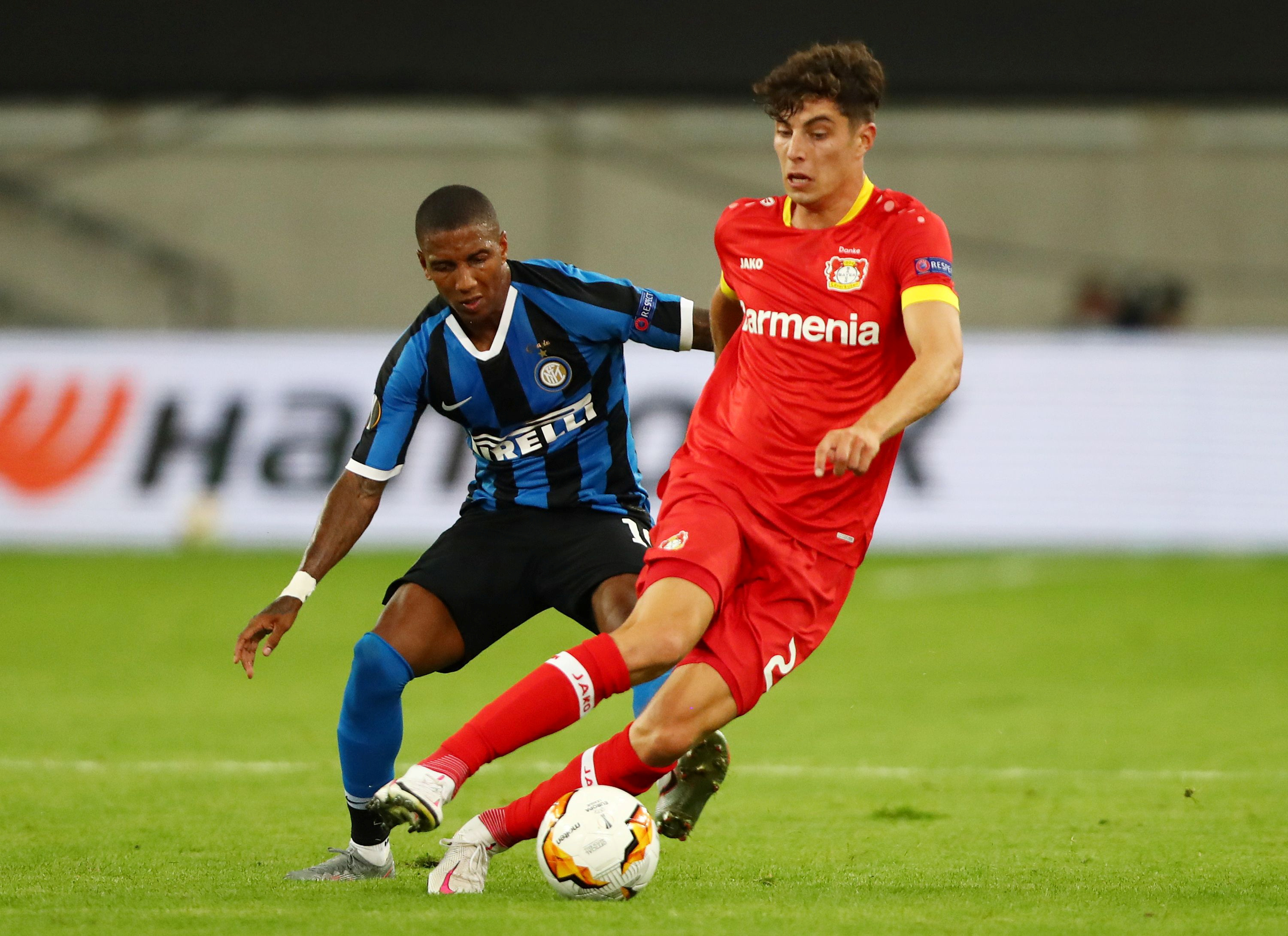 Bayer Leverkusen's Kai Havertz in action with Inter Milan's Ashley Young, as play resumes behind closed doors following the outbreak of the coronavirus disease (COVID-19). Photo: Reuters 