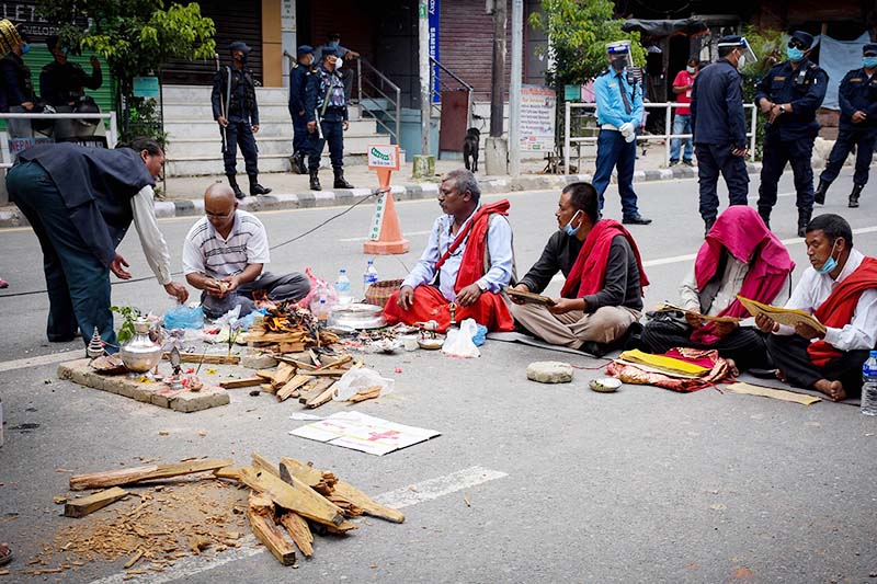 Priests performing Kshama Puja, a religious repentance for failure to proceed ahead with the chariot procession of the Rain God Rato Machhindranath amid curfew, at Pulchowk, Lalitpur, on Friday, September 4, 2020.nNaresh Shrestha / THT